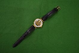 Gents wrist watch with skeleton movement.