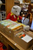 A large quantity of Rupert annuals, Beatrix Potter books and a large Rupert the Bear.