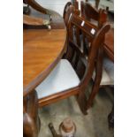 A set of four mahogany dining chairs.