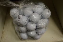 A bag of Taylor Made golf balls.