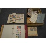 A box of stamps and stamp albums.