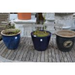 Three glazed plant pots.