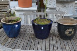 Three glazed plant pots.