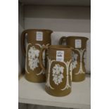 Graduated set of three brown jasperware vases.