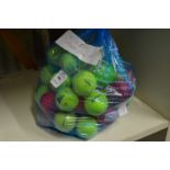 A bag of fifty mixed coloured golf balls.