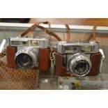 A Voigtlander Vitomatic IIa together with a Vitomatic IIb, both with cases.