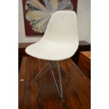 A Vitra Eames DAR side chair.