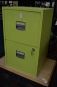 A lime green two drawer metal filing cabinet.