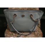 A Coach pale blue leather handbag.