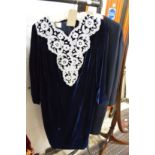 A stylish ladies blue velvet dress with pearl decoration.