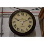 J W Benson, an oak cased circular wall clock.