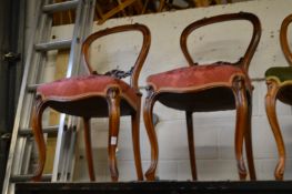 A pair of Victorian walnut dining chairs.