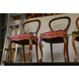 A pair of Victorian walnut dining chairs.