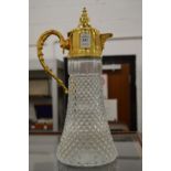 A gilt metal mounted glass claret jug.