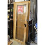 An oak framed and glazed door.