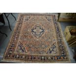 A Persian rug, rust ground with stylised decoration 190cm x 150cm.