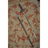 An early 19th century sword and scabbard, possibly made for theatrical use.