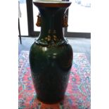 A large Chinese style green glazed pottery vase.