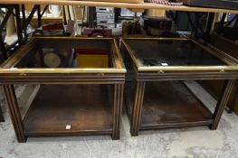 A pair of two tier coffee tables (one lacking glass).