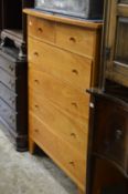 Gilbert Logan and Sons, a cherry wood chest of drawers.