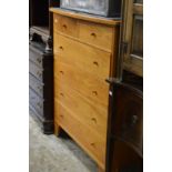 Gilbert Logan and Sons, a cherry wood chest of drawers.