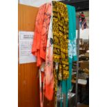 Four colourful sarongs.