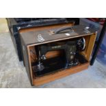 A Singer sewing machine with case.
