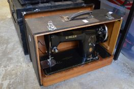 A Singer sewing machine with case.