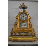 A French ormolu and porcelain mantel clock on stand.