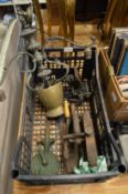 A brass chandelier, crimping machines and other items.