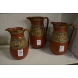 Graduated set of three Greek revival terracotta jugs.