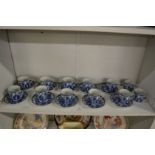 A set of ten Chinese blue and white coffee cups and saucers and a pair of matching cups.