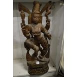 A large carved wood Eastern deity.