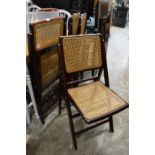 A set of four folding chairs.