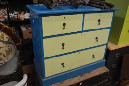 A painted pine chest of drawers.