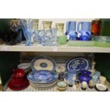 Two shelves of decorative and household china and glass.