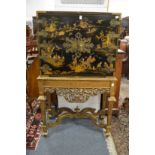 A good chinoiserie decorated cabinet of gilt wood stand with ornate brass strap work.