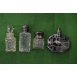 Silver topped scent bottles.