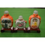 Three Chinese snuff bottles.