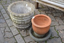 A reconstituted stone garden planter, terracotta pot and a shallow bird bath.