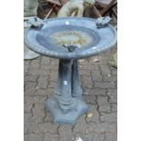 A good lead bird bath with circular top on a triple column support with concave sided base.