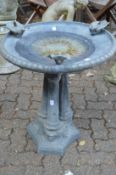 A good lead bird bath with circular top on a triple column support with concave sided base.