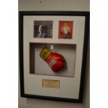 Boxing interest, a signed Sir Henry Cooper boxing glove, framed and glazed with associated