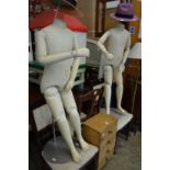 Two adjustable mannequins on stand.