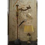 A pair of unusual Italian style carved gilt wood and gesso floor standing lamps (faults).