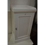 A white painted pot cupboard.