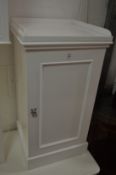 A white painted pot cupboard.