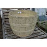 A large reconstituted stone garden planter.