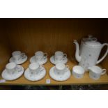 A Suzie Cooper White Wedding coffee service and a similar teapot.