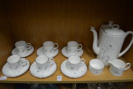 A Suzie Cooper White Wedding coffee service and a similar teapot.